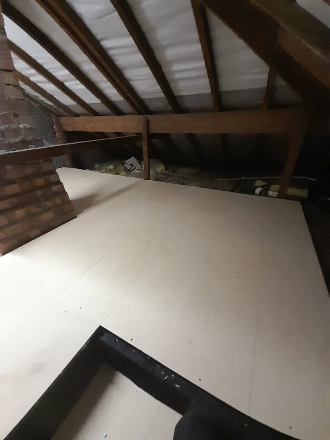 Client-supplied photograph of a completed boarded loft floor