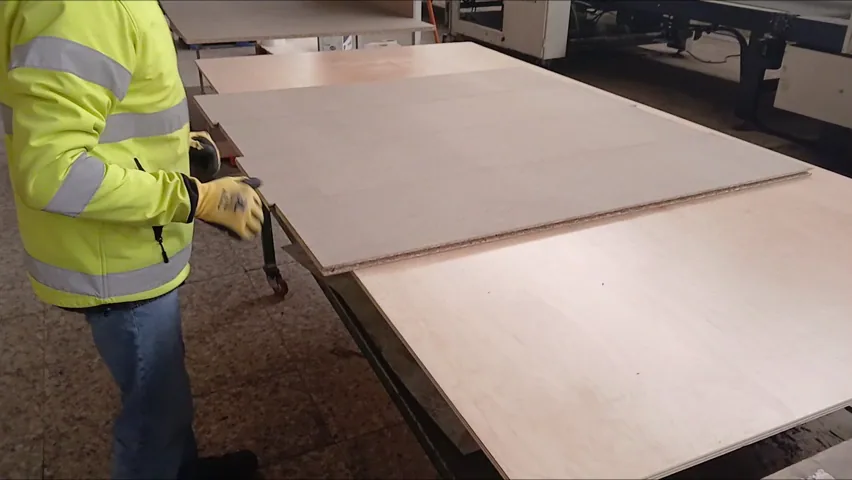 A Loftspan board being handled during a factory demonstration